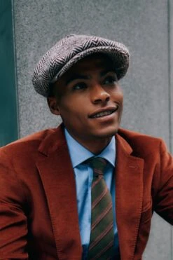 Muirfield Herringbone Bakerboy Cap 17 Muirfield Herringbone Bakerboy Cap -Lock and Co. Hatters Store MUIRFIELD HERRINGBONE BAKERBOY CAP LIFESTYLE SHOT 2